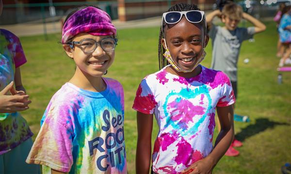 Two girls smile